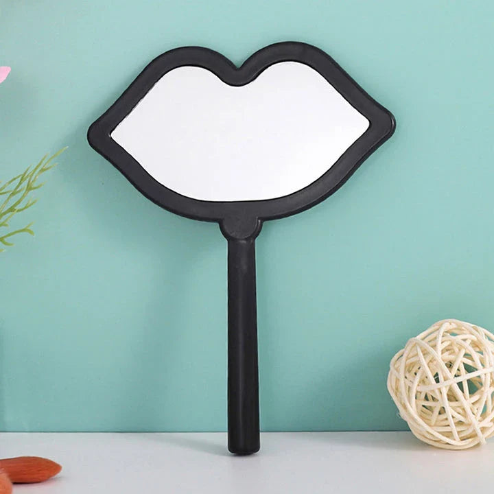 Lip-shaped handheld makeup mirror with a comfortable ergonomic handle for precise on-the-go touch-ups
