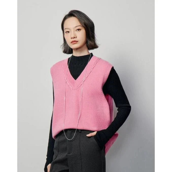 Elegant sleeveless v-neck knit vest in rose red and black colours, with a stylish split back design for a flattering silhouette