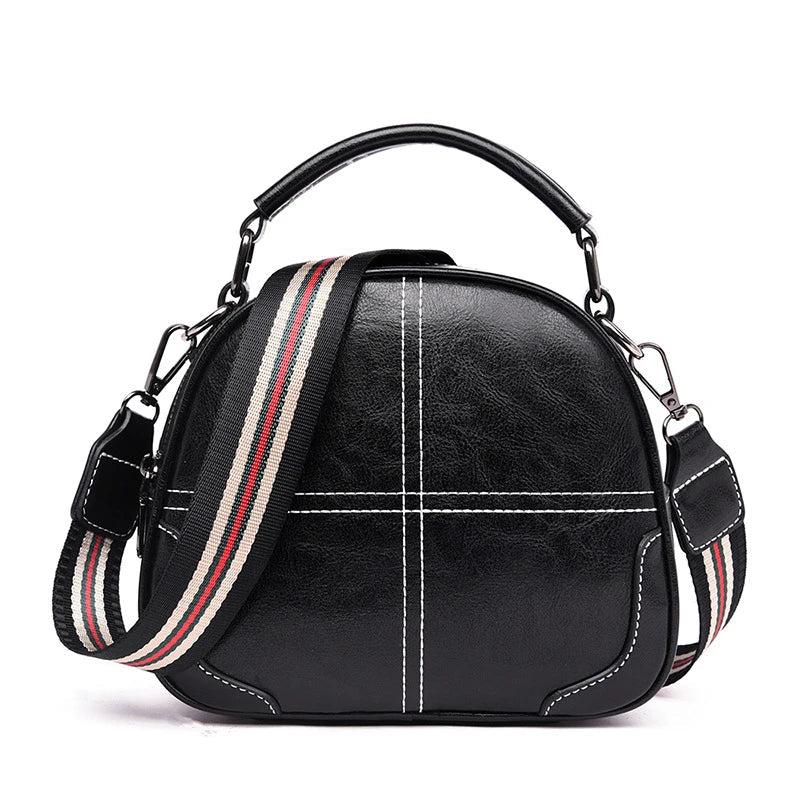 A stylish and versatile stitched shoulder bag in a classic brown colour, featuring a sleek oval shape and multiple interior compartments for organised storage.