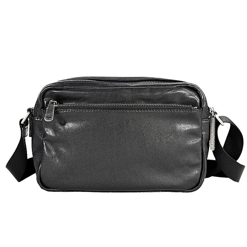 A premium British leather shoulder bag with a sleek, minimalist design and adjustable strap