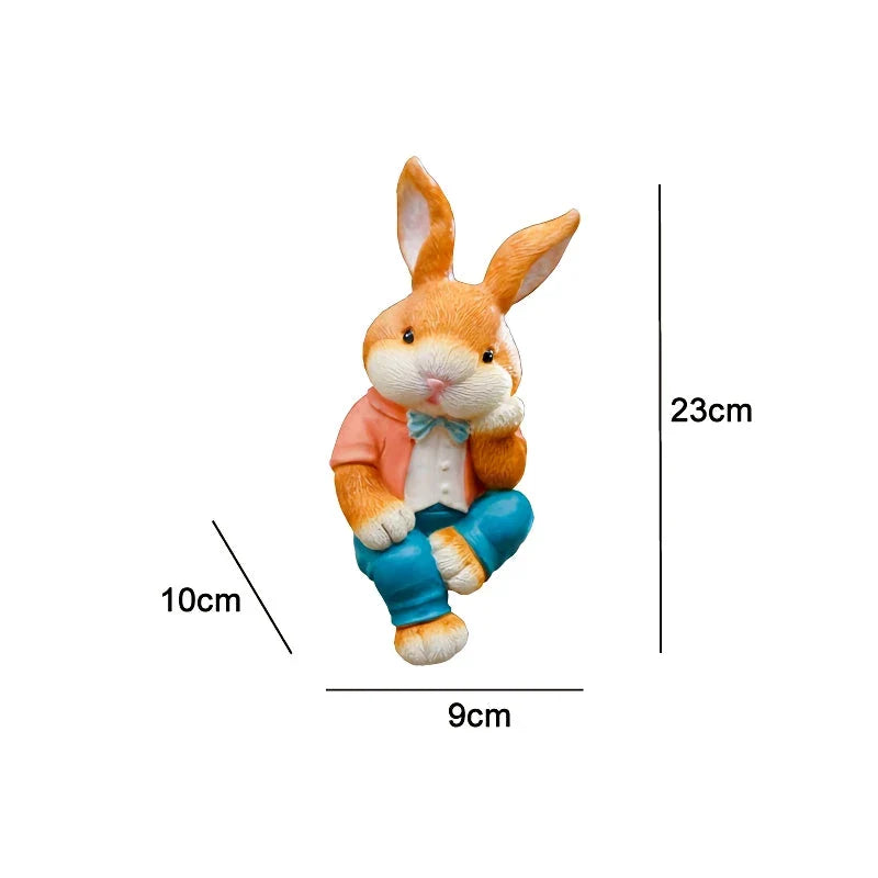 A detailed and lifelike resin statue of a thoughtfully sitting rabbit, adding a whimsical touch to any home or garden decor.