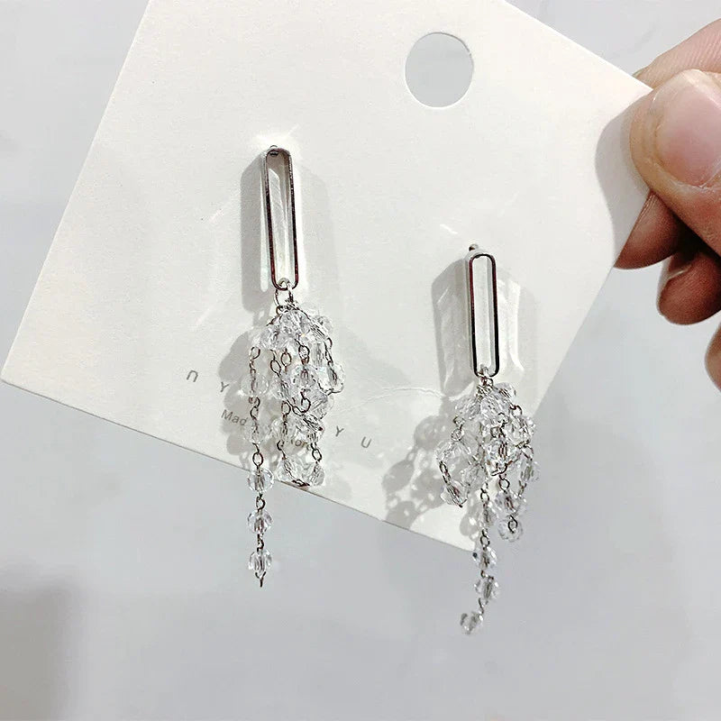 Elegant crystal grape cluster earrings with a cascading, geometric design in a premium gold finish