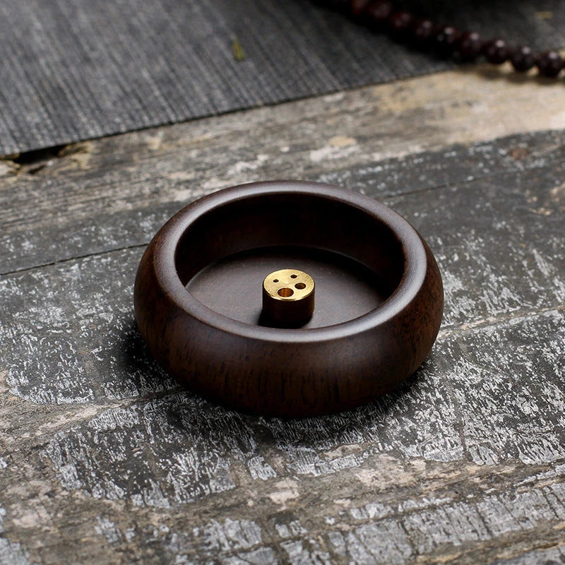 Elegant black sandalwood incense holder with four different caliber sizes to accommodate various incense sticks