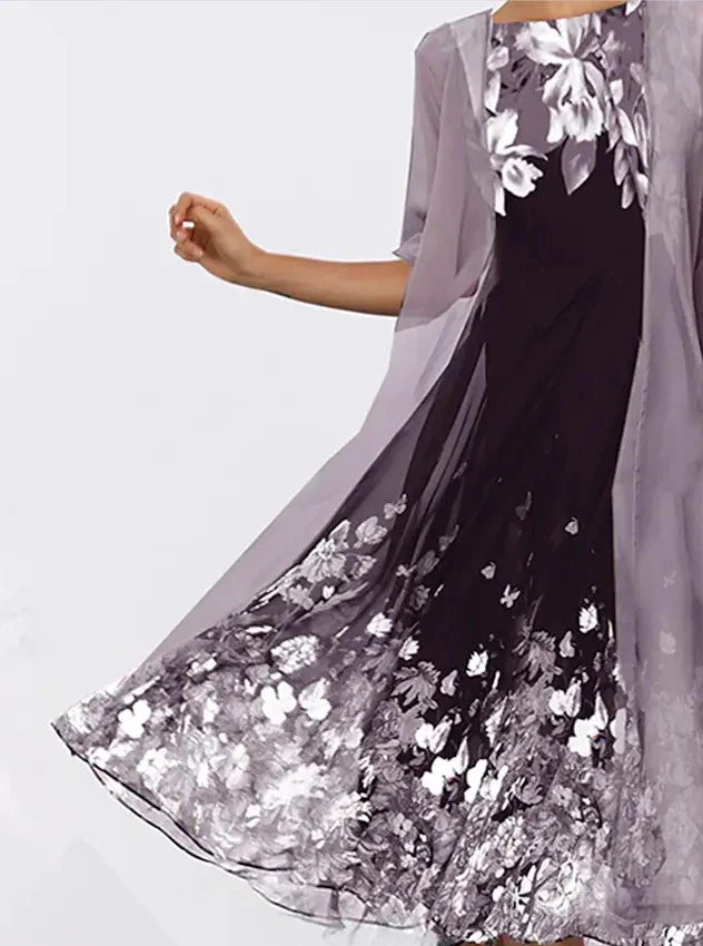 A stylish, multi-colour long dress made from high-quality chiffon fabric, featuring a comfortable swing skirt and versatile 3/4 sleeves.