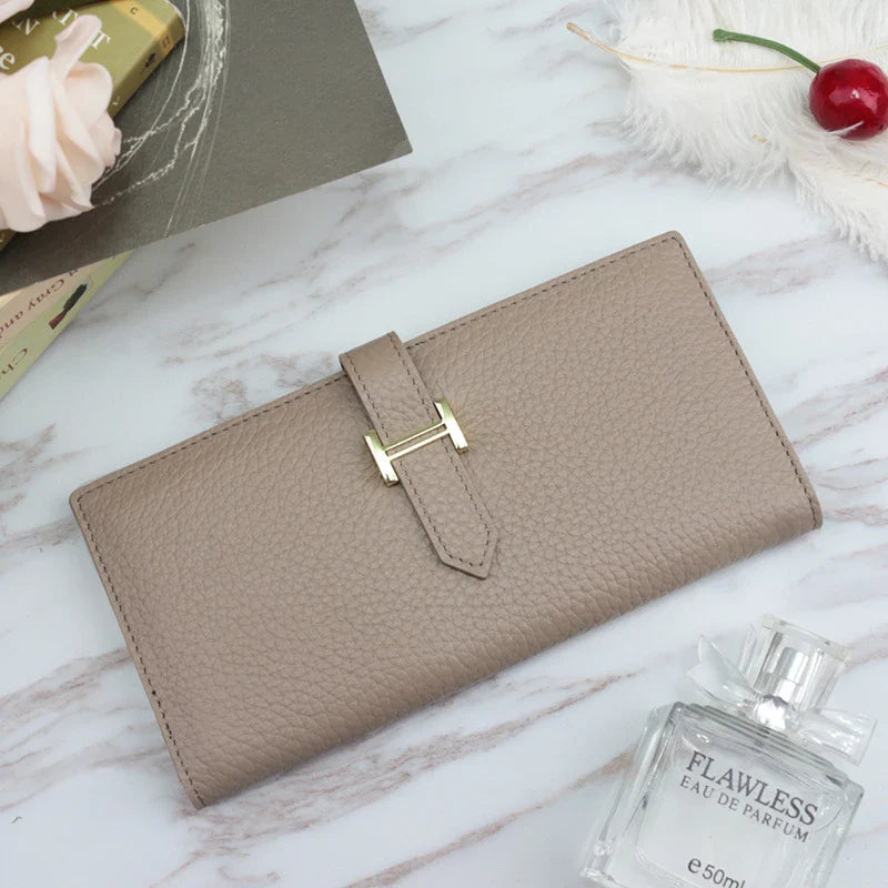 A stylish and practical long wallet made from premium leather, featuring a convenient drawstring closure to keep your essentials organised and secure.