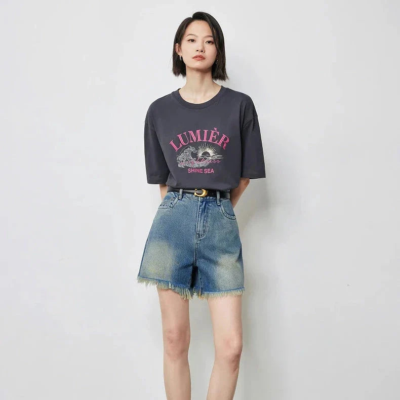 Vintage-inspired high-waisted denim shorts with tassel detailing for women