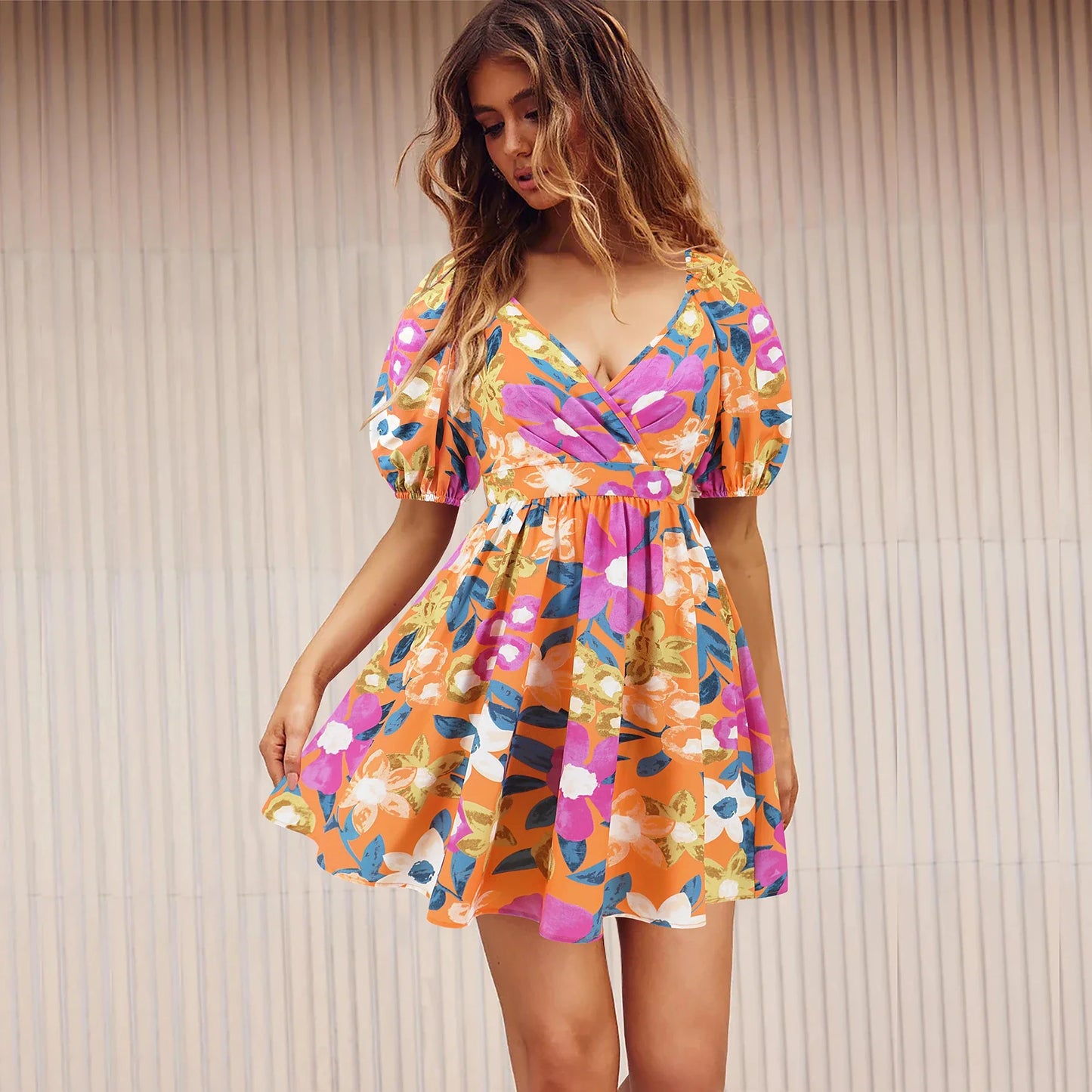 Stylish lantern-sleeve v-neck beach dress in vibrant summer colours, featuring a flattering fit and comfortable stretch fabric