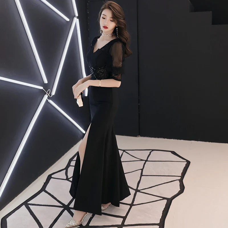 Elegant black evening dress with middle-length sleeves, perfect for formal occasions in the UK