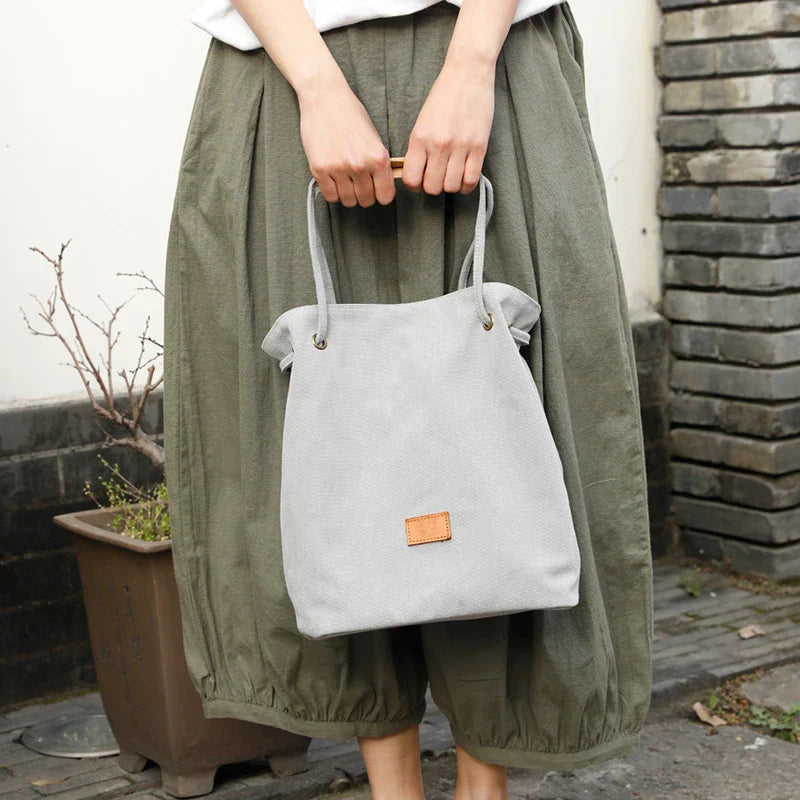 Premium canvas lattice shoulder bag in various colours, featuring a spacious design with secure zipper closure and adjustable strap for comfortable everyday carry