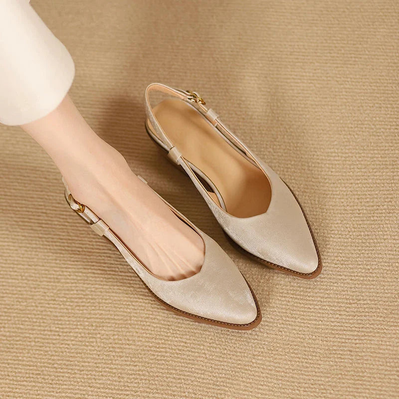 Elegant slingback leather pumps with a stylish mule design, secure buckle closure, and 4cm square heel