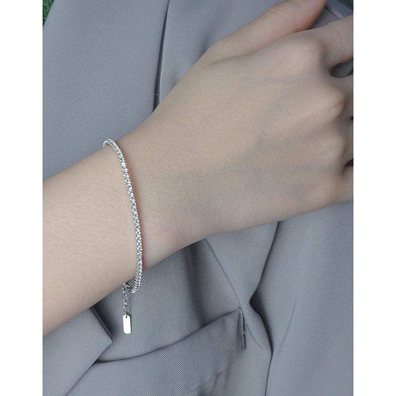 Sparkling silver geometric bracelet with adjustable clasp and intricate patterns