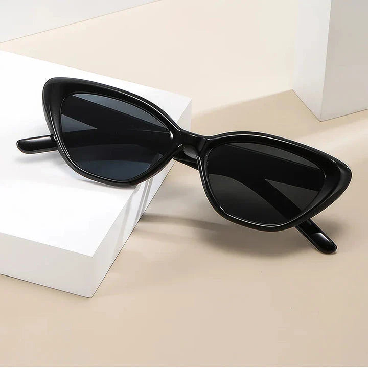 Classic cat-eye sunglasses with rice nail detail, offering UV protection and gradient lenses for a timeless, sophisticated look.