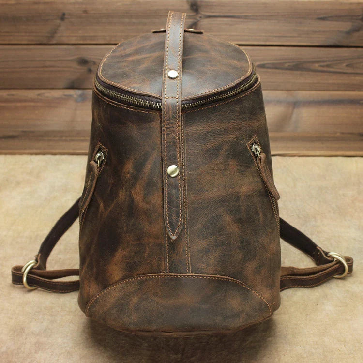 A premium Crazy Horse leather backpack with a classic bucket-style design and retro-inspired flair, perfect for the discerning urban adventurer.