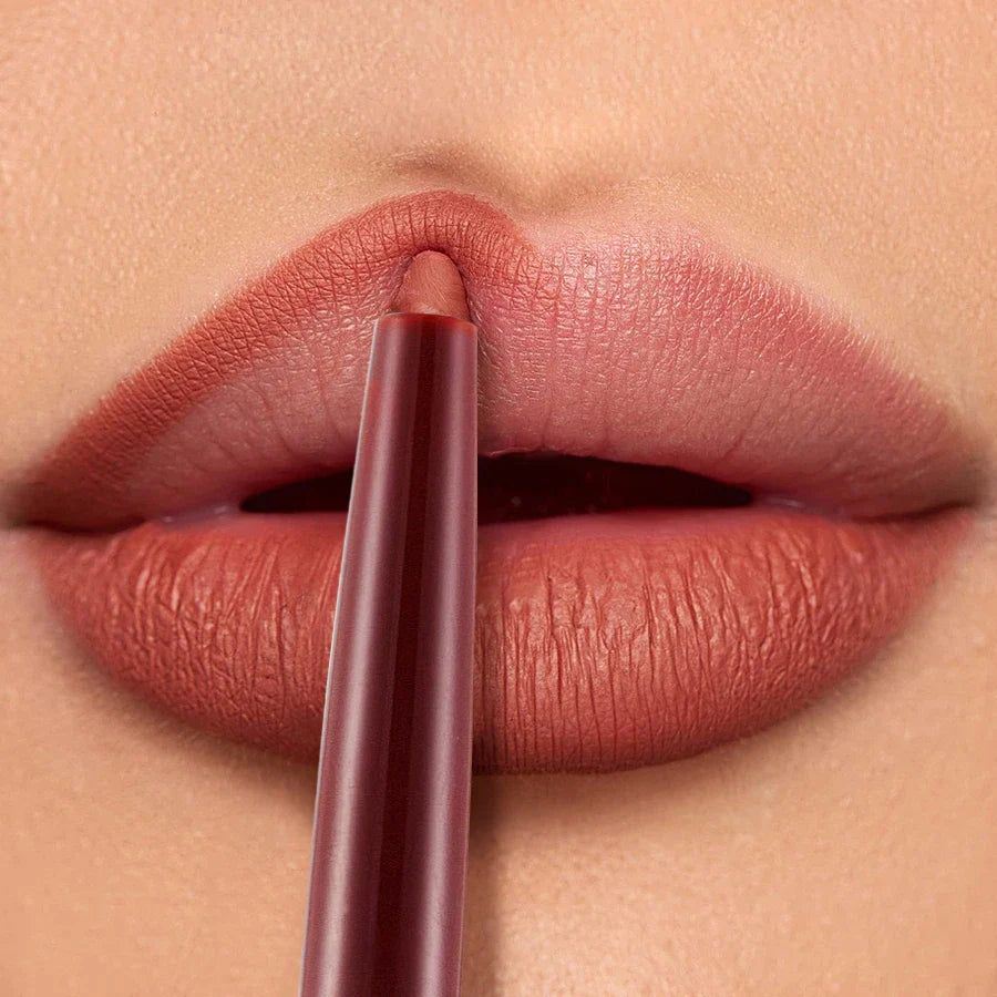 Close-up of a premium waterproof lipliner in a silver casing, a must-have makeup essential for a polished and long-lasting lip look.