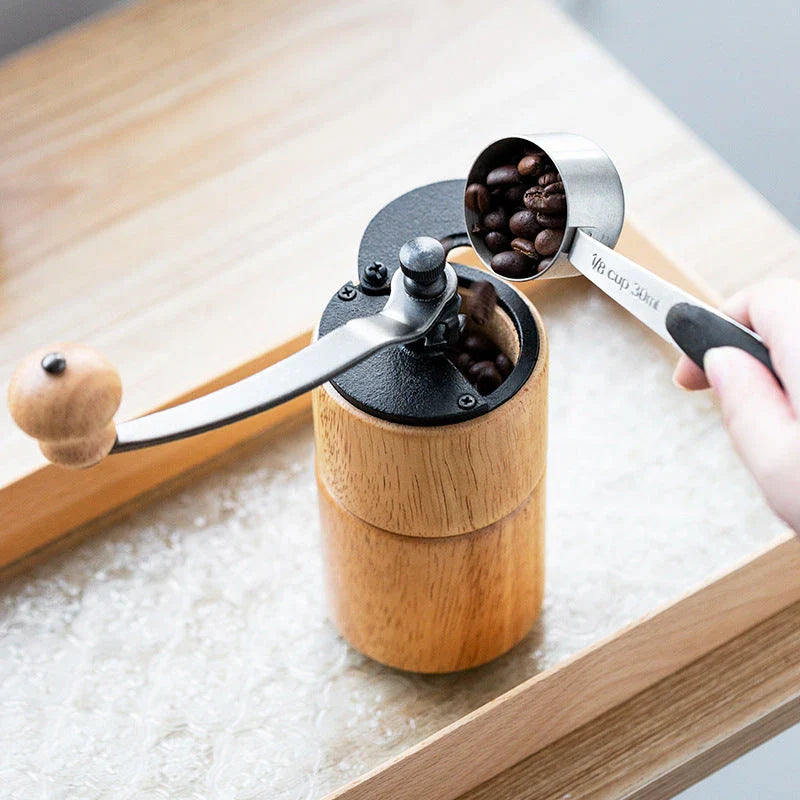 Elegant wooden manual coffee grinder with premium steel conical burr for consistent, flawless grinding
