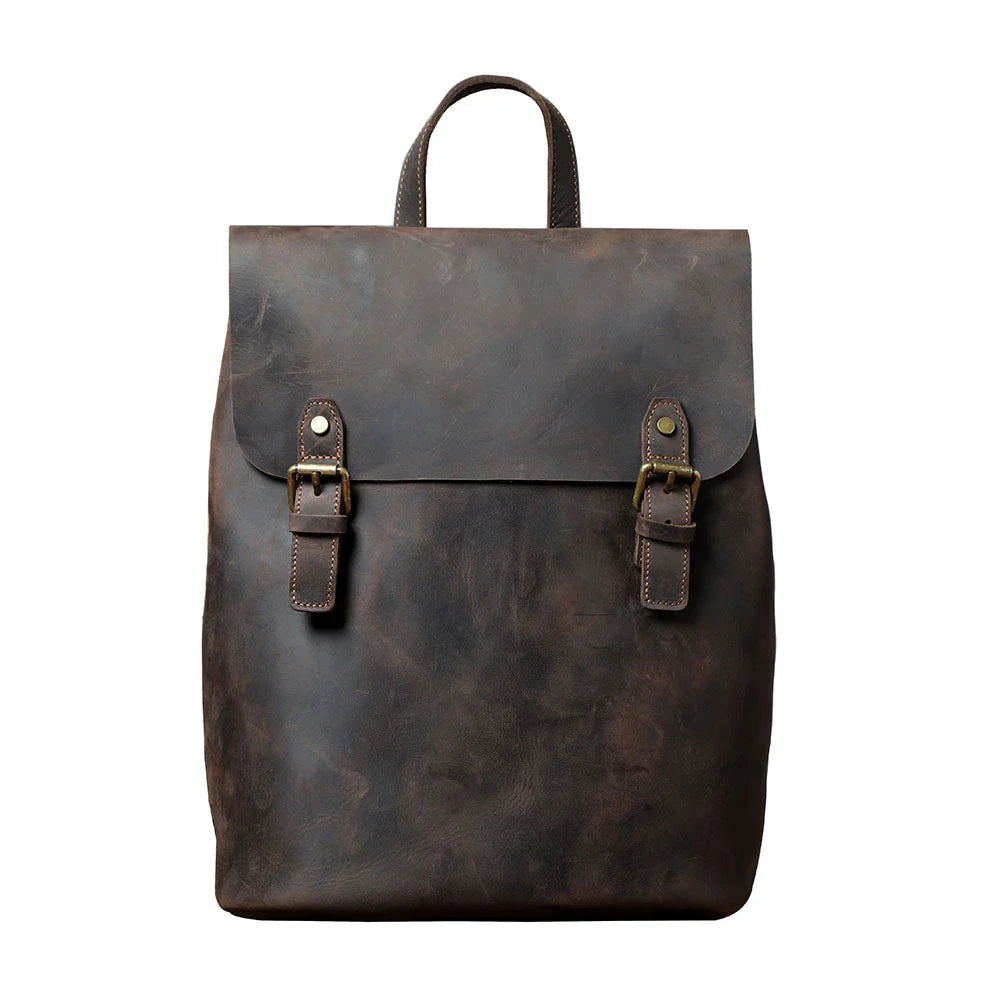 Premium vintage leather backpack with a classic design, featuring a spacious main compartment and adjustable padded shoulder straps for comfortable wear.