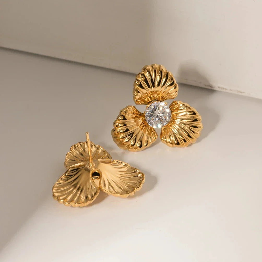 Elegant 18K gold-plated stainless steel flower stud earrings with sparkling zircon inlays, designed for timeless style and all-day comfort.