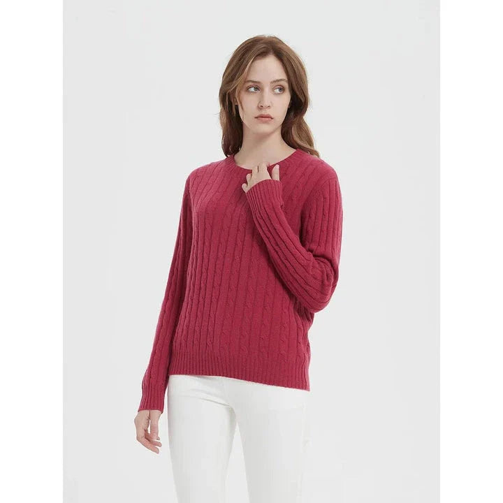A luxurious 100% British wool cable knit jumper in a rich camel colour, perfect for keeping warm during the UK's chilly winters.
