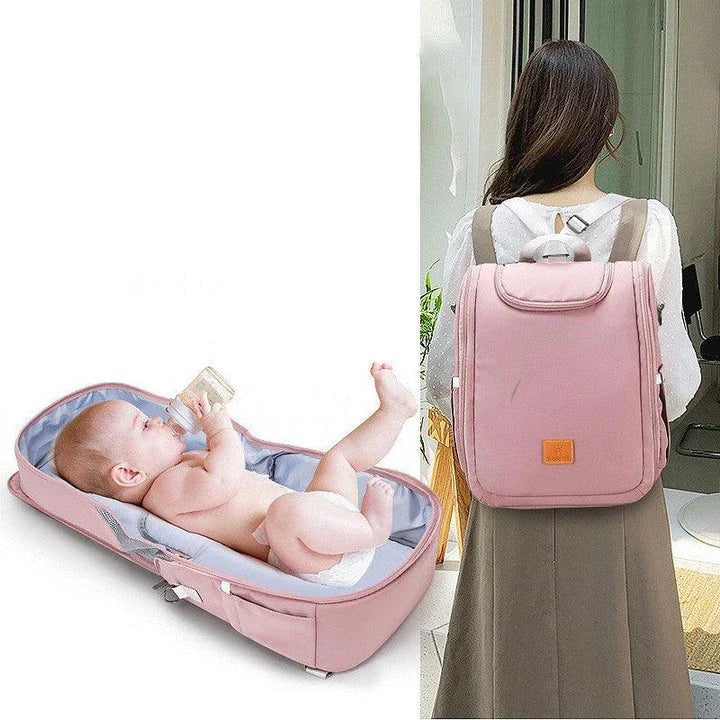 Versatile baby changing backpack with convertible crib bed, large storage capacity, and insulated feeding bottle compartment