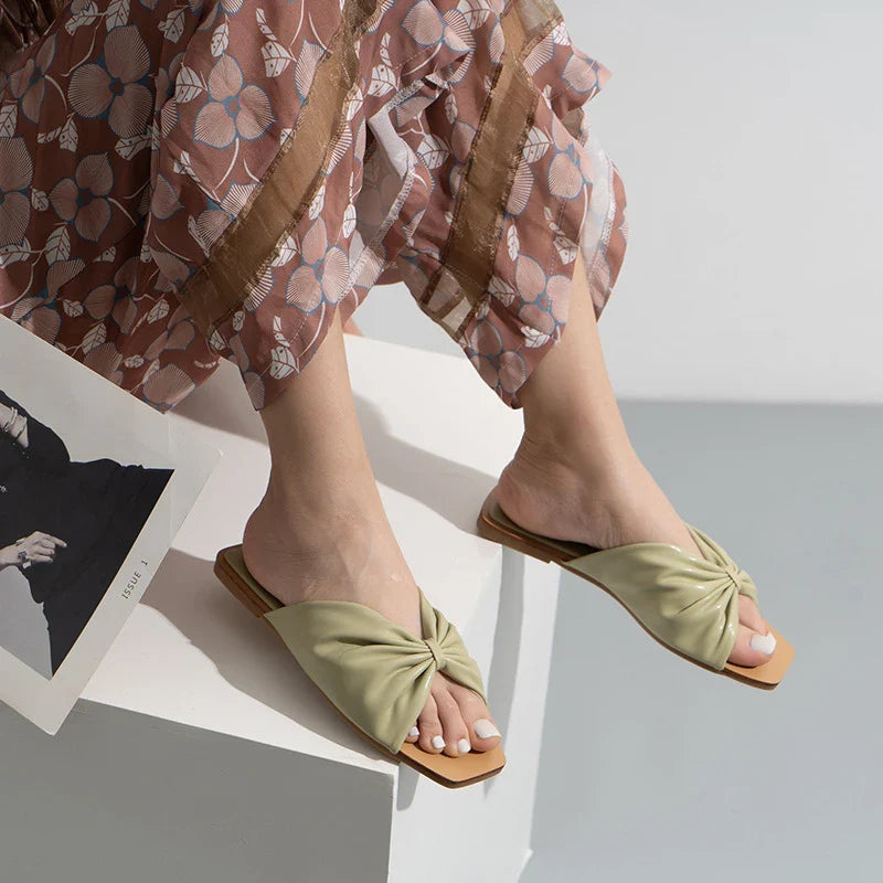 Stylish bow-accented flat sandals for women in multiple colours