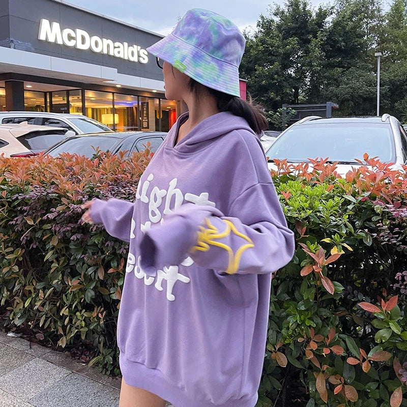 Trendha Two-Tone Hooded Sweatshirt with Star Print in Purple