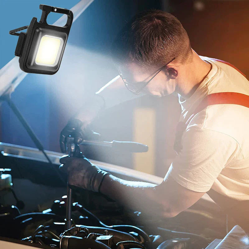 A compact, powerful, and versatile keychain light with a magnetic base, foldable handle, and bright LED illumination for UK adventures