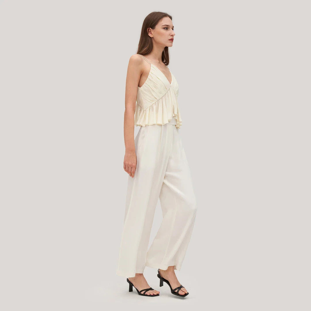 Elegant and refined silk camisole with V-neck design and delicate spaghetti straps, perfect for the modern British fashion enthusiast