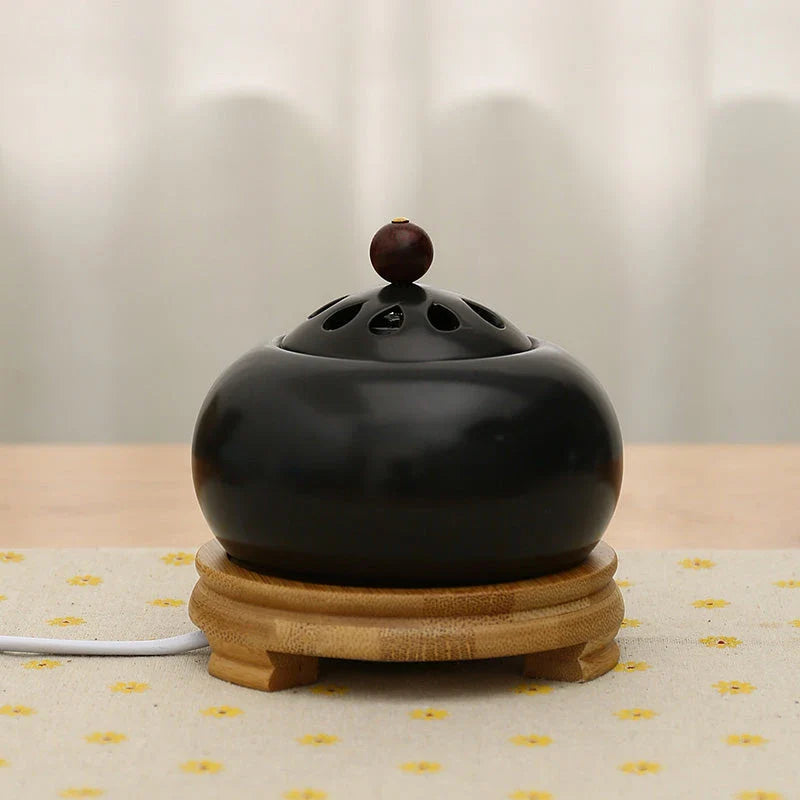 Elegant electric incense burner with adjustable temperature and timer function, perfect for creating a soothing ambiance in your home.