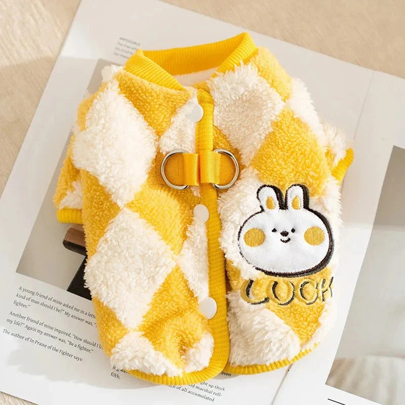 A stylish checkered fleece coat for small and medium-sized dogs, providing warmth and comfort during the chilly British autumn and winter seasons.