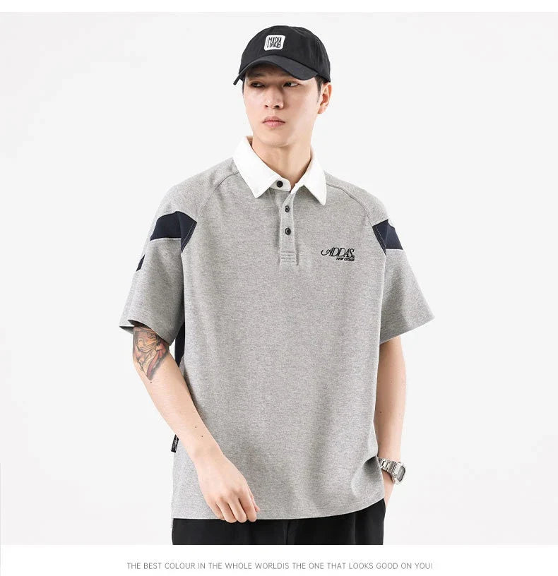 Melange grey polo shirt with contrast stitching, designed and made in Britain for comfortable summer wear