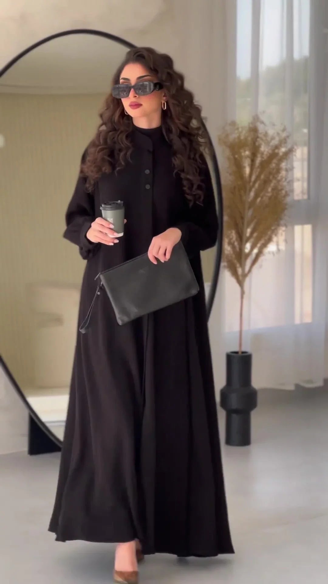 Premium black commuter swing skirt dress with long sleeves and an elegant A-line silhouette