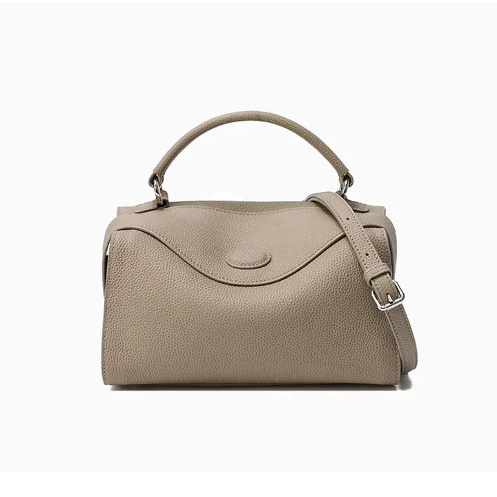 Premium British cowhide leather shoulder bag with multiple interior pockets and adjustable strap for versatile wear