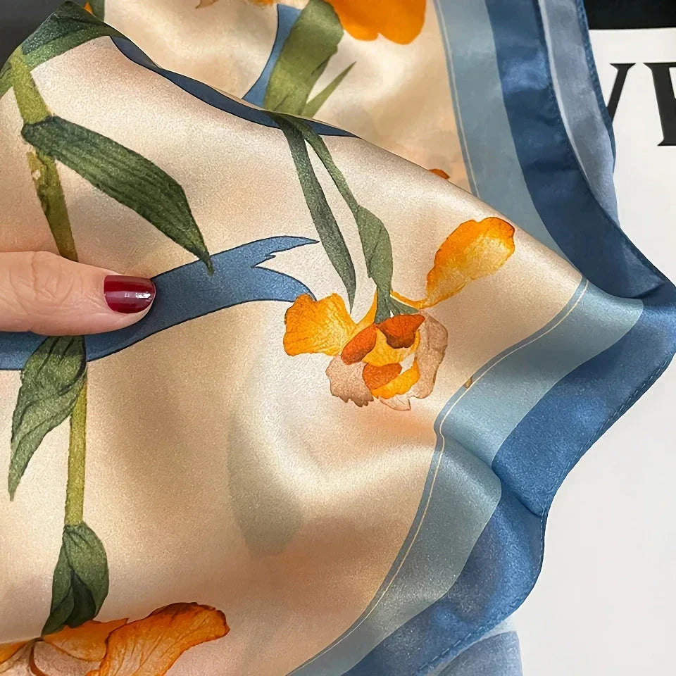 Luxurious floral 100% silk square scarf for women, featuring a charming print and versatile design.