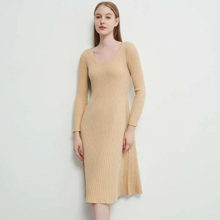 Elegant and cosy midi sweater dress in black, featuring a solid, body-hugging silhouette and comfortable knit fabric