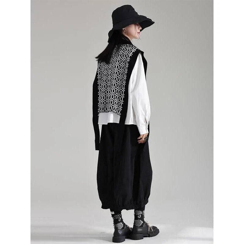 Women's black sleeveless vest with irregular knitting pattern, a versatile and stylish layering piece for the modern British woman