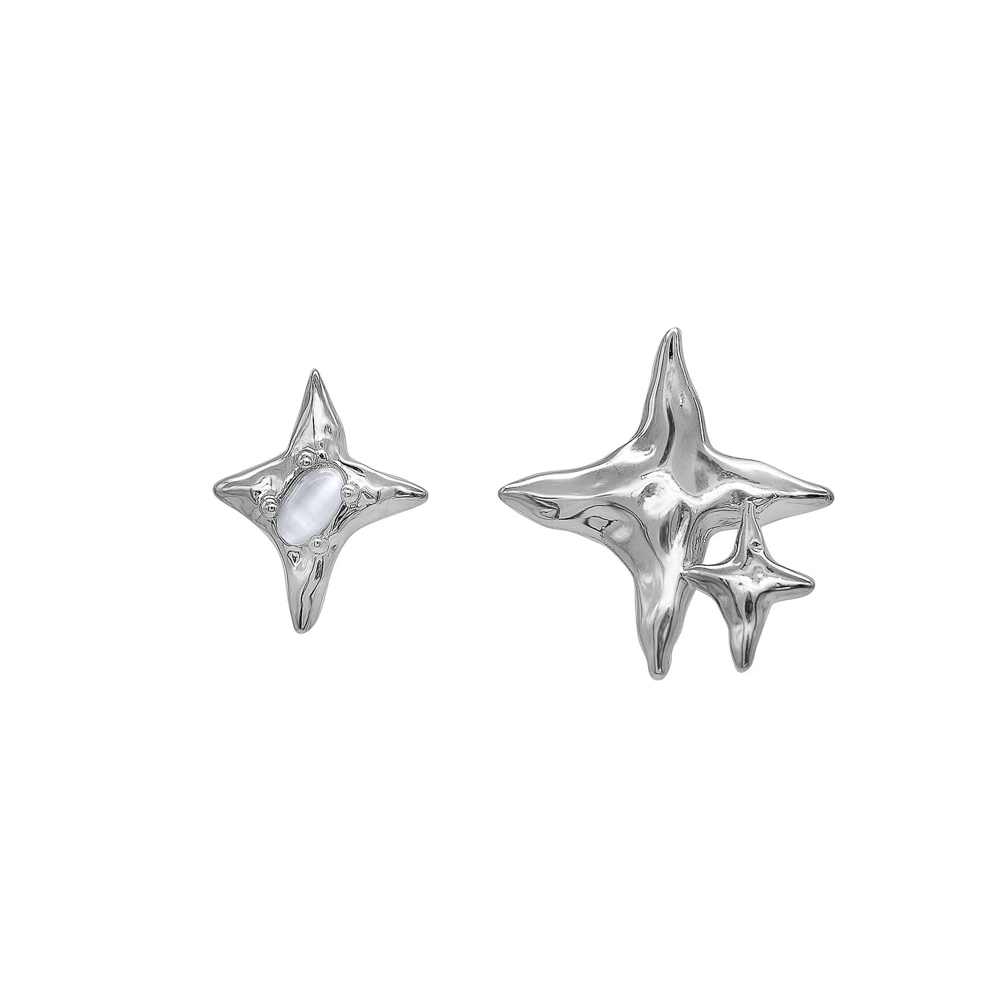 Pair of asymmetric silver stud earrings with intricate water drop and bell patterns, designed for modern British women