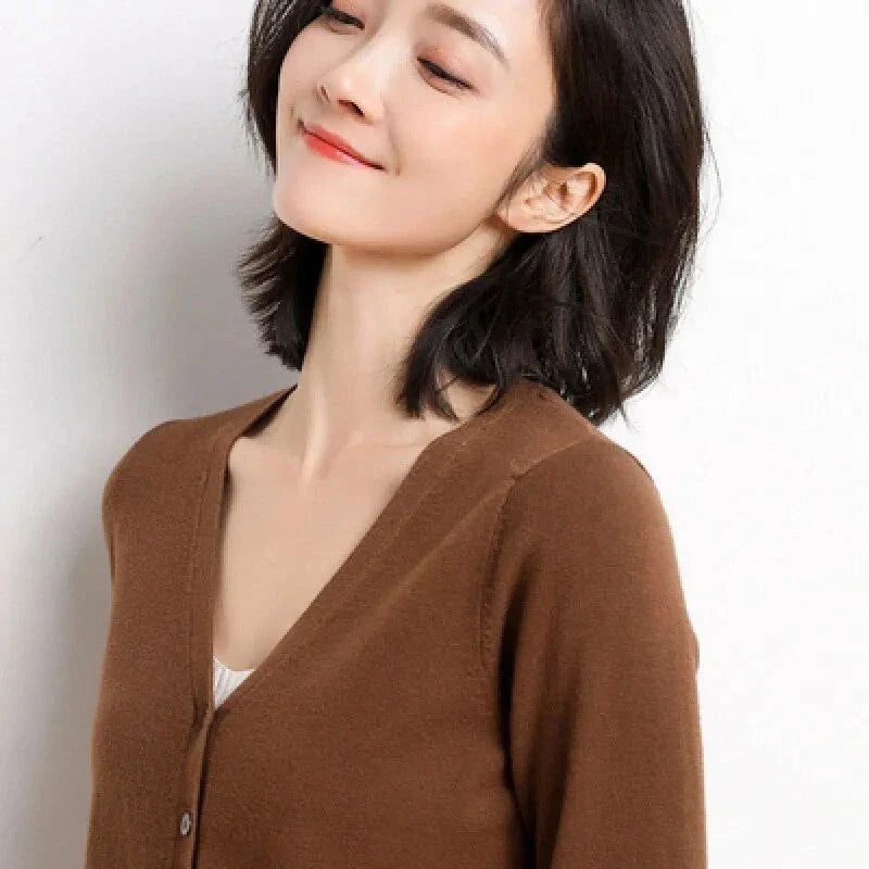 Chic v-neck single breasted cardigan in blue, green, and pink colours with a sophisticated and timeless design