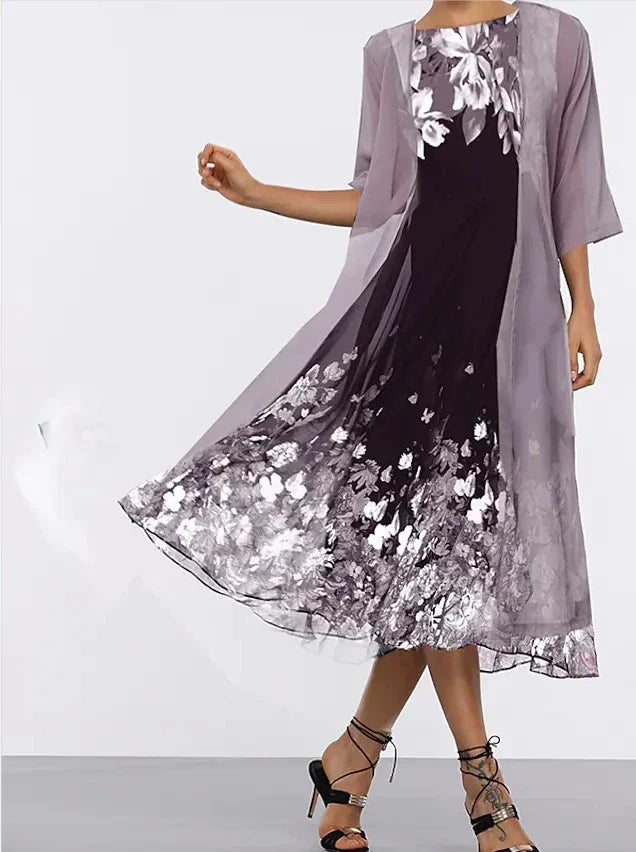 A stylish, multi-colour long dress made from high-quality chiffon fabric, featuring a comfortable swing skirt and versatile 3/4 sleeves.