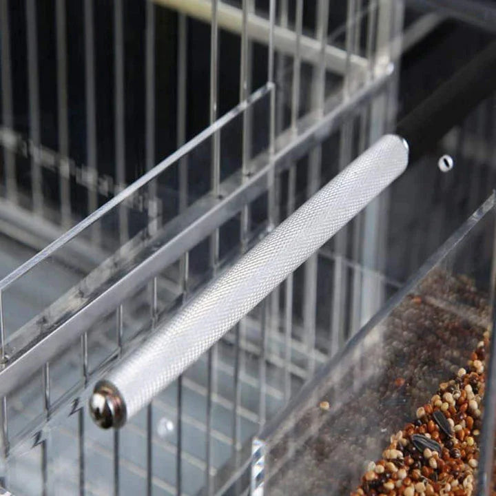 A transparent acrylic bird feeder cube with a sleek and modern design, perfect for adding a touch of elegance to your garden or balcony.