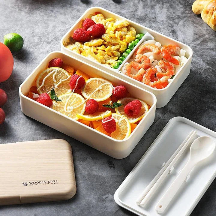 Premium BPA-free double-layer lunch box with stainless steel spoon and chopsticks, perfect for office, picnics, and on-the-go dining