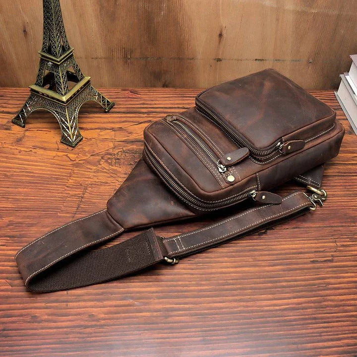 Vintage-inspired genuine leather briefcase with multiple compartments and secure zipper closure, ideal for modern commuters