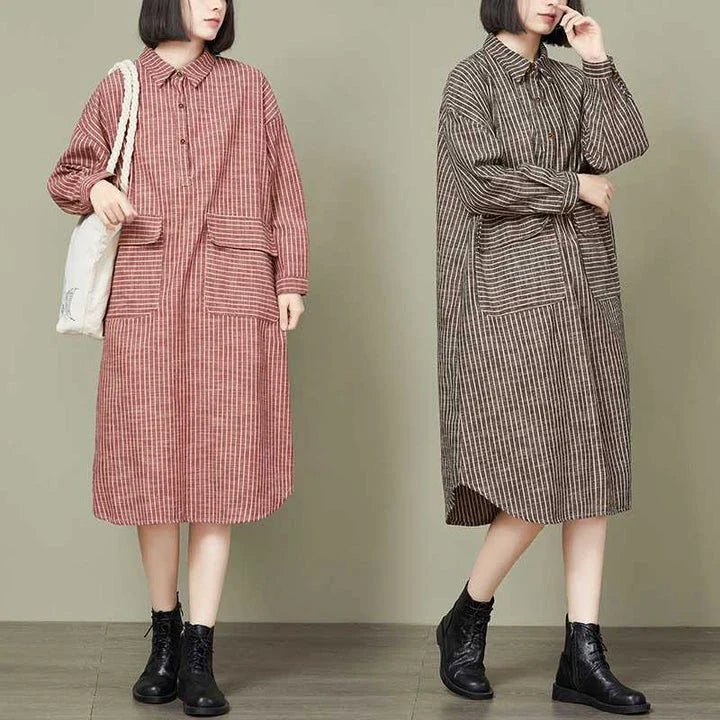 Plus-size women's dress with a striped pattern, asymmetric skirt, and long loose sleeves