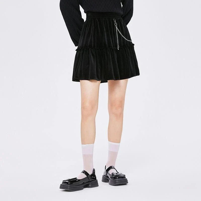 A stylish and playful above-knee mini skirt with intricate chain detailing, offering a versatile and fashionable addition to any wardrobe.