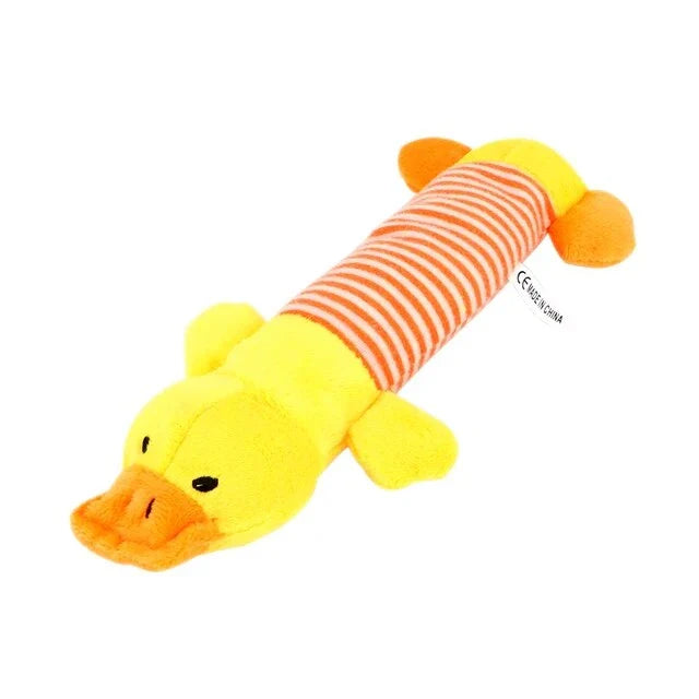 Premium plush squeaky dog toy in various colours, featuring textured stripes for dental cleaning and a built-in sound generator for interactive play.