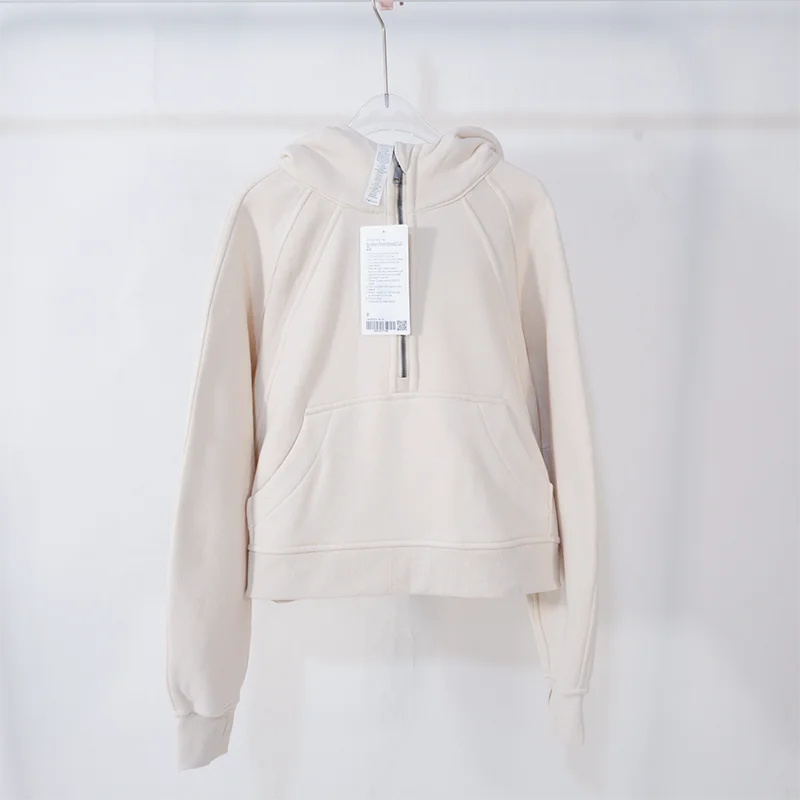 Premium women's sports fleece hoodie with half zip, available in a range of sophisticated colours