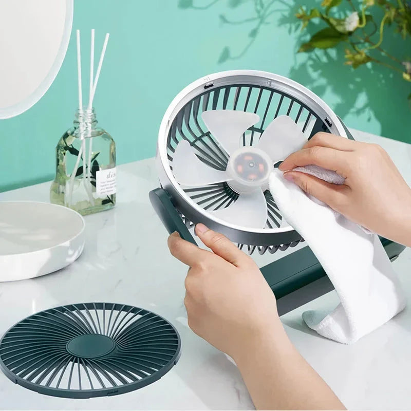 A compact, rechargeable USB desk fan with adjustable speed settings and a tilting head for targeted airflow.
