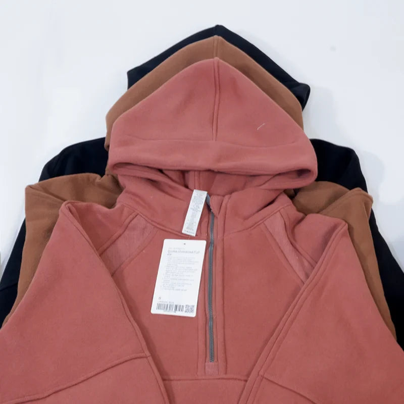 Premium women's sports fleece hoodie with half zip, available in a range of sophisticated colours