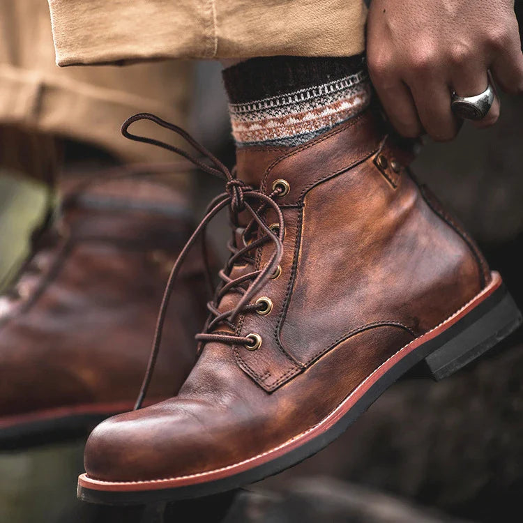 Stylish khaki Martin boots with a camouflage pattern, perfect for the modern British gentleman