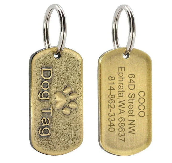Vintage-style personalized pet ID tag made from durable metal, featuring engraved text for customization and a classic design.