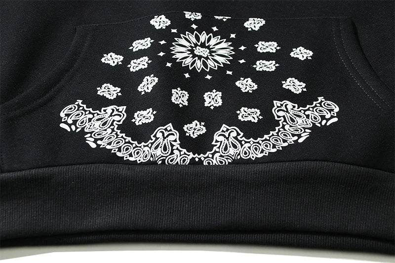 A cosy, fleece-lined hoodie with a classic paisley pattern, a relaxed fit, and practical side pockets for easy style and comfort.